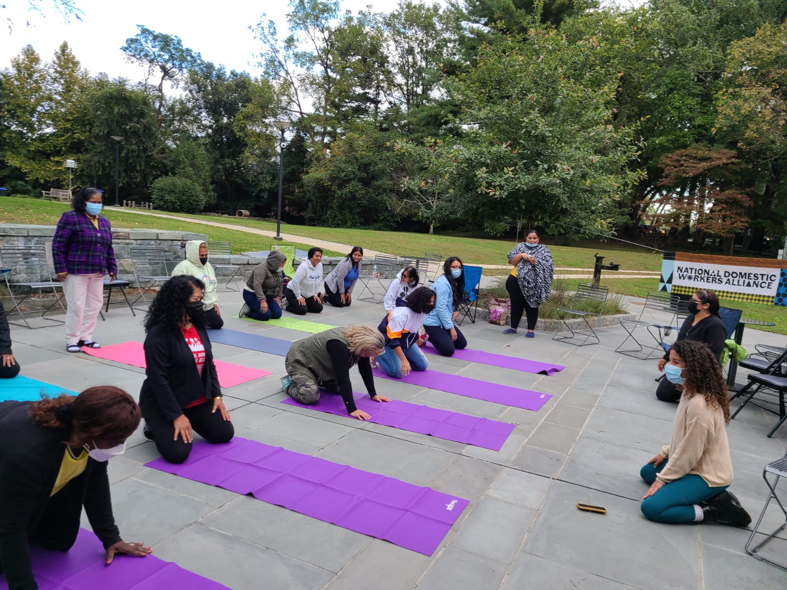 DMV chapter members participate in a yoga class at a monthly membership meeting