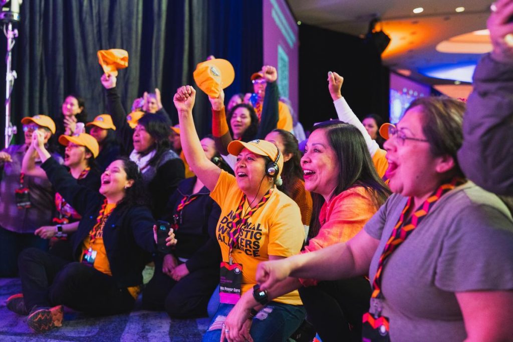 Delegations cheering on the newly elected board! (Photo by Stefan A. Photography)