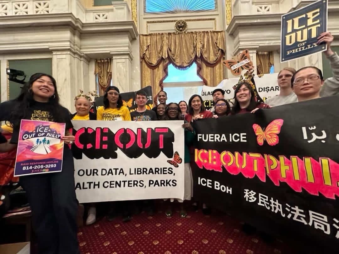 Workers celebrate the ICE Out legislation being passed.