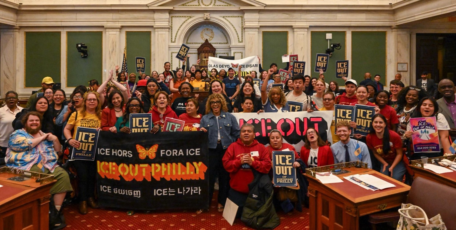 Workers celebrate the ICE Out legislation being passed.